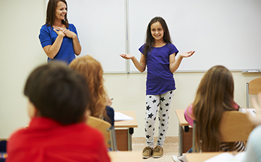 student explaining to class