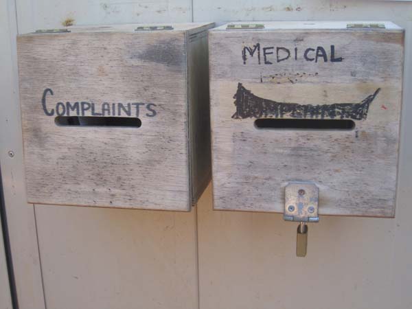 Unlocked complaints box next to locked medical request box, Curtin IDC