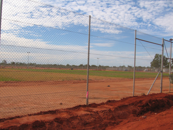 Looking out from inside the Curtin IDC perimeter fence over the unfinished oval