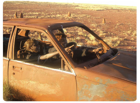 Jeanette Gordon, Mona Sunfly, Danika Kingsley (toddler) of the Kukutja people in Balgo, Western Australia. 