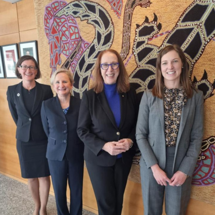 Four women stand and smile, they are AHRC Chief Executive Leanne Smith, Australia's Permanent Representative to the UN, Amanda Gorely, AHRC President Emeritus Professor Rosalind Croucher AM and Human Rights Adviser Nina Pregellio.