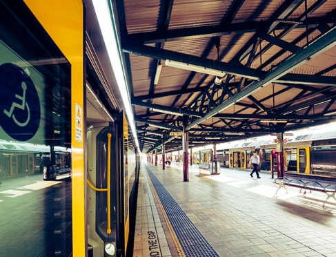 Train with doors open at Central Station, disability access sticker visible