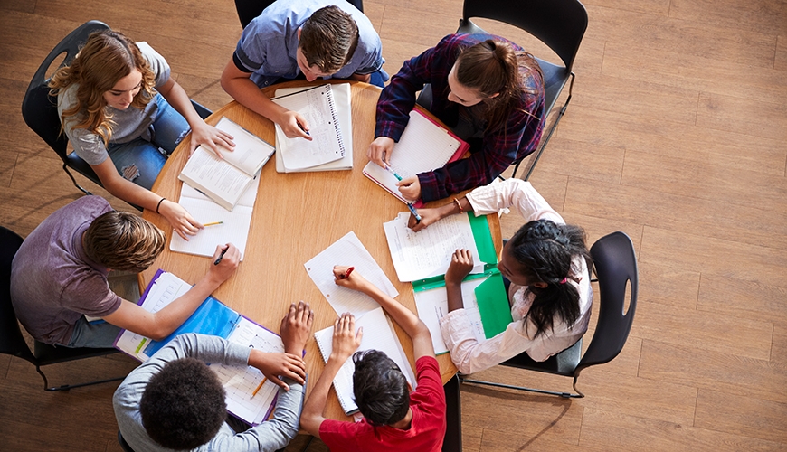 overhead photo of students working on assignment