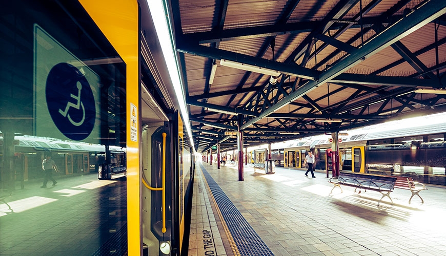 Train with doors open at Central Station, disability access sticker visible