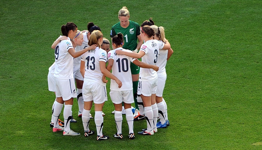 Womens FIFA team in huddle