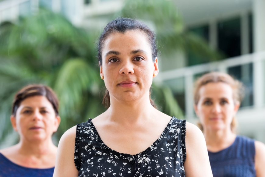 Three hispanic mature women posing looking at the camera serious.