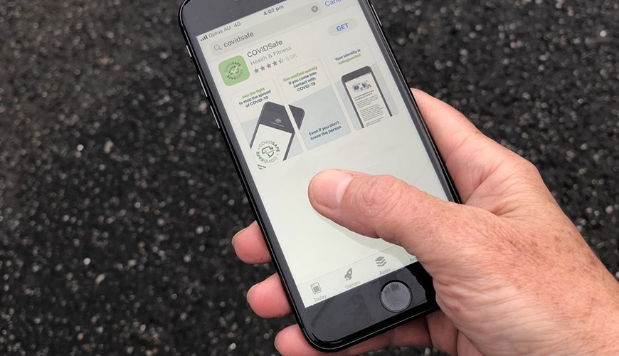 COVIDSafe App - hand holding iphone with the COVID-19 application