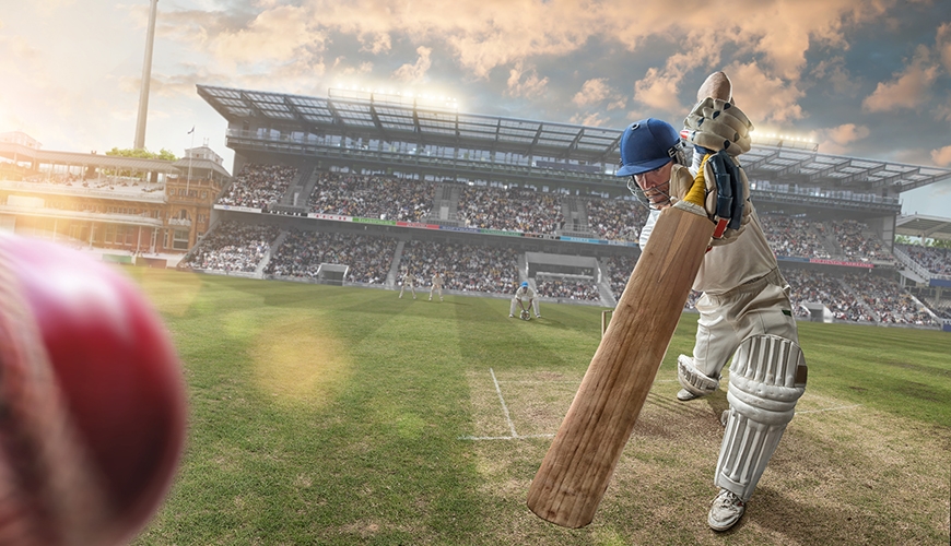 cricketer hitting ball in the stadium