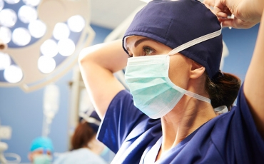 Doctor wearing mask in operating theatre