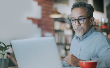 Older man working on computer