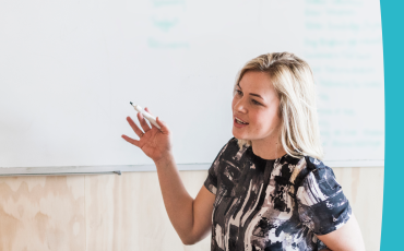 Guidelines for the targeted recruitment of people with disability. Image of woman in wheelchair in front of whiteboard 