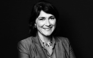 black and white headshot of women with mid length dark hair