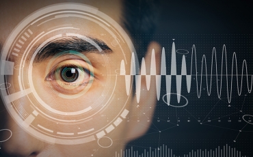 A man's eye surrounded by mathematical lines and diagrams