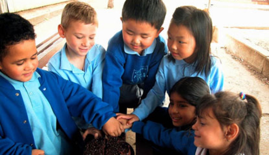 Photo: Cooperation by Amanda Lim - school children sharing a cake