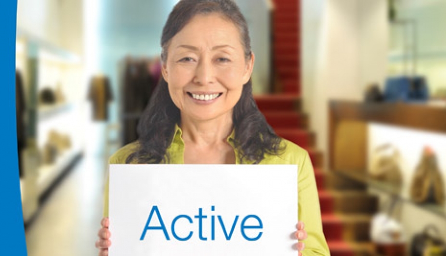 older woman with a sign "Active"