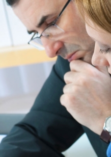 Man and woman in business meeting