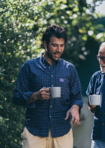 Two men in conversation one older and one younger