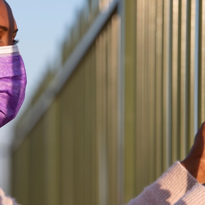 Person in detention centre in covid mask