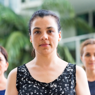 Three hispanic mature women posing looking at the camera serious.